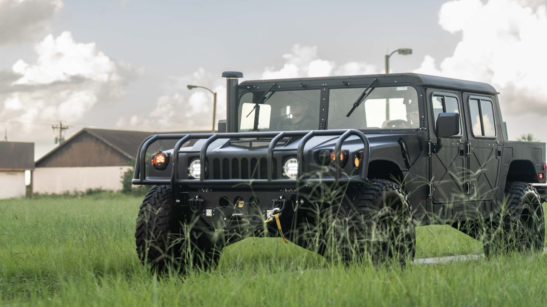 Humvee in tall grass