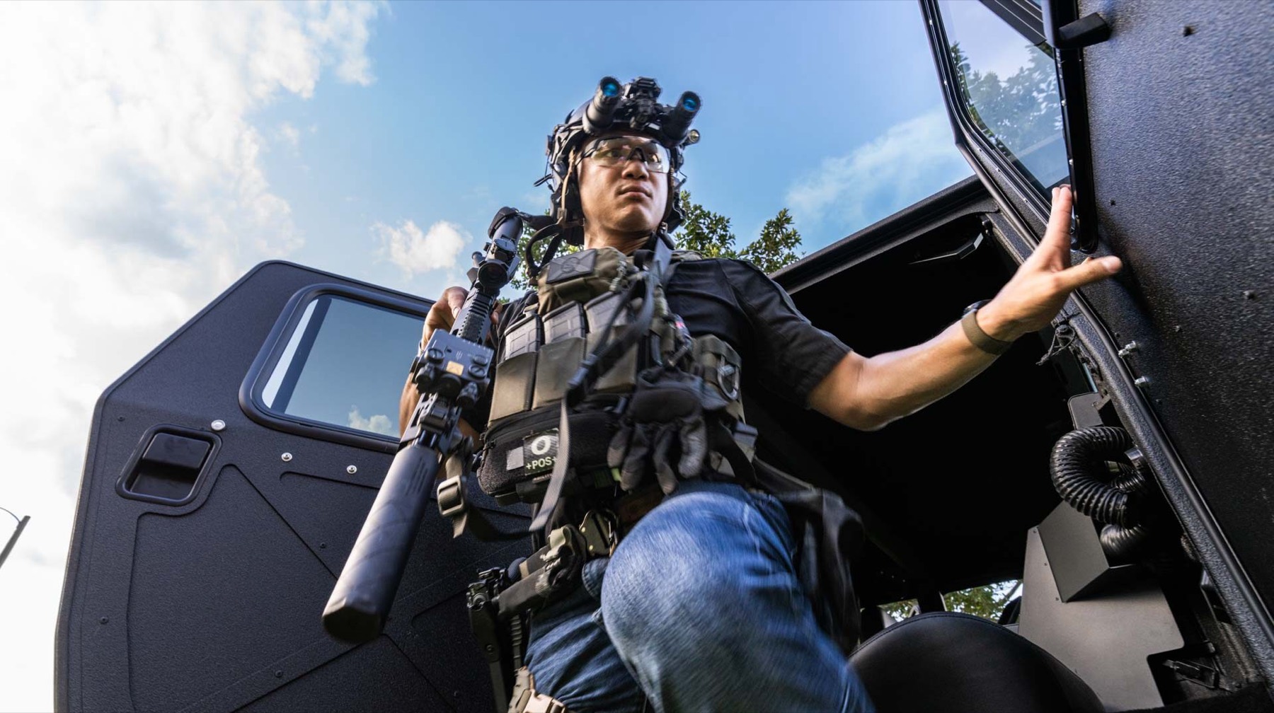 Operator stepping out of armored vehicle